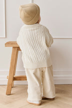 Pantalon décontracté en coton uni coloris avoine avec taille élastiquée et accessoires sans nickel pour enfants de 6 mois à 8 ans